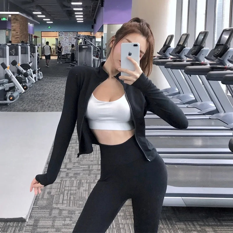 Tops cortos deportivos de manga larga con cremallera ajustada para mujer para correr en el gimnasio