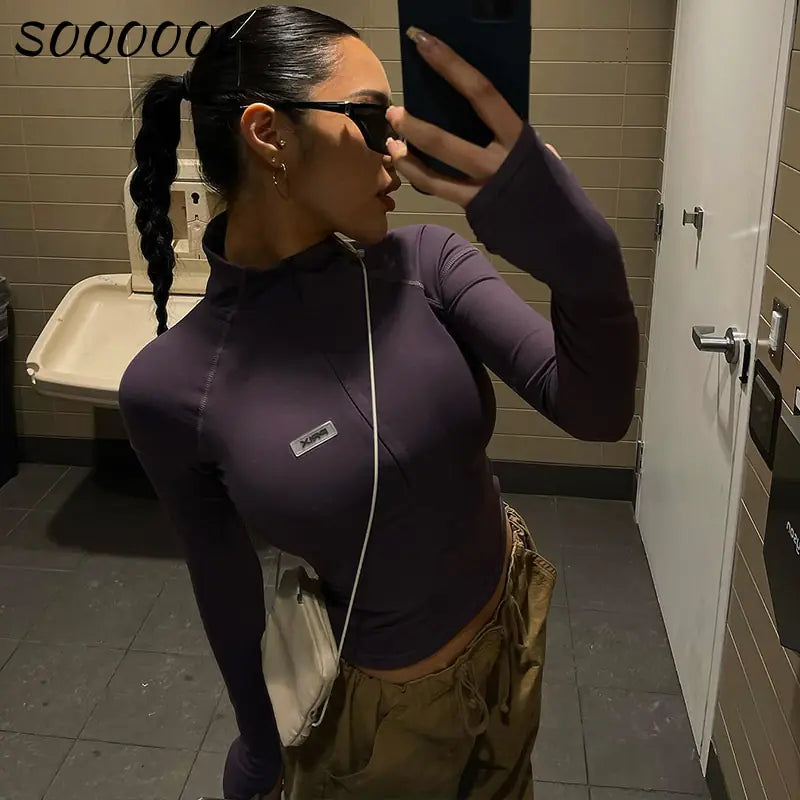 Camiseta con cremallera y manga larga para mujer