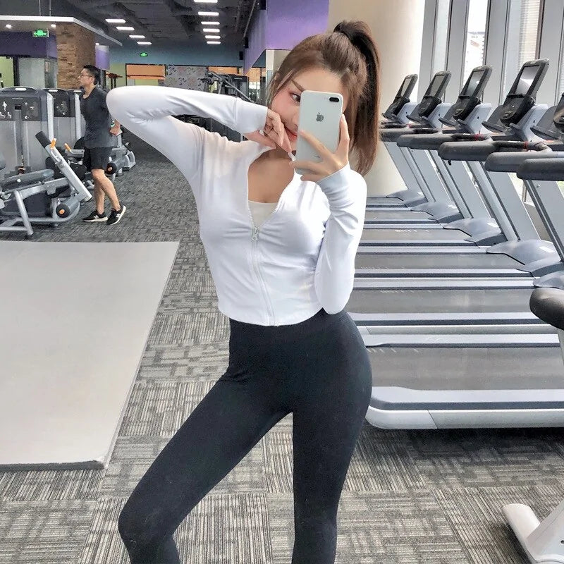 Tops cortos deportivos de manga larga con cremallera ajustada para mujer para correr en el gimnasio